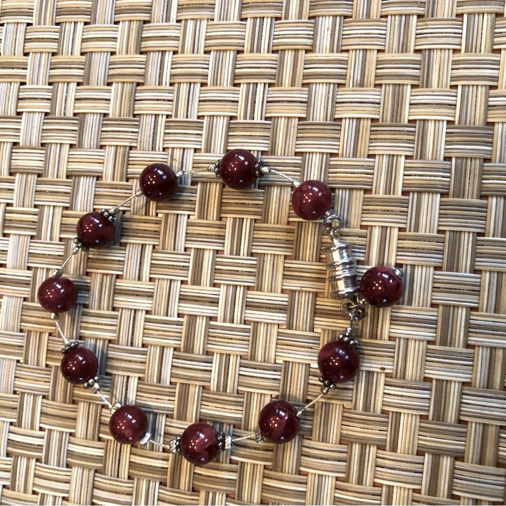 Stunning deep red beaded bracelet with magnetic clasp.